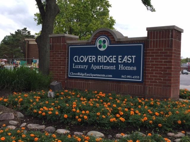 A monument sign introduces a luxury apartment complex