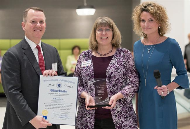 Denise and Tim Carr receive awards for their FASTSIGNS center