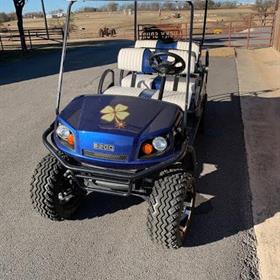 A golf cart features custom wrap on it